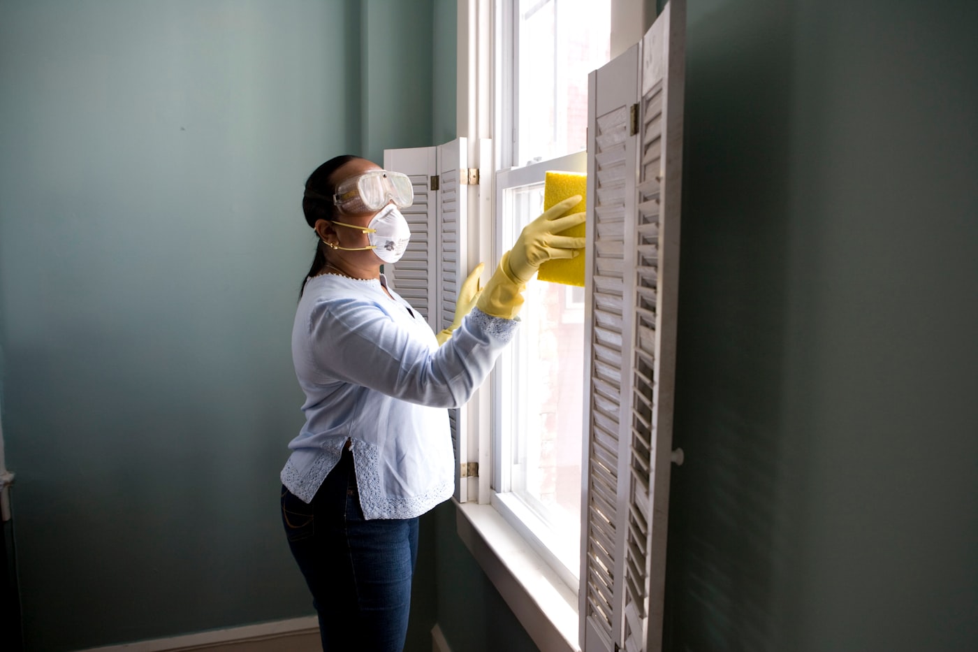 Professional cleaner in a bright office space